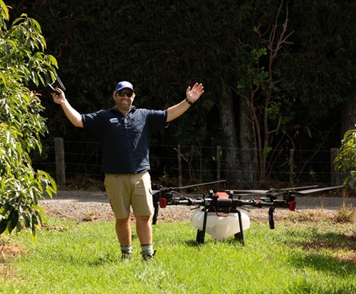 Stu McLeod Certified Drone Operator next to his large payload drone in Whangarei