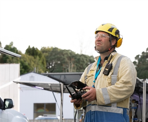 Drone water blasting of a large commercial building for an instant clean